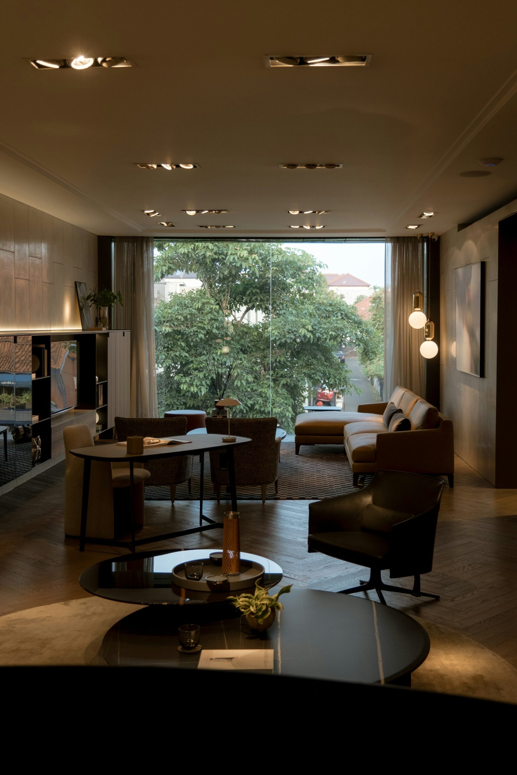 A quiet, lived-in interior with furniture arranged around a large window